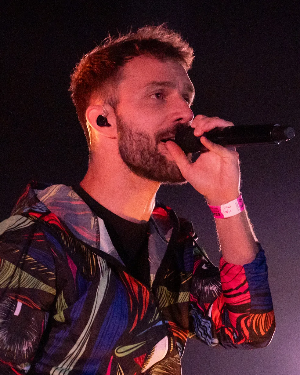 A performer with a microphone at a concert