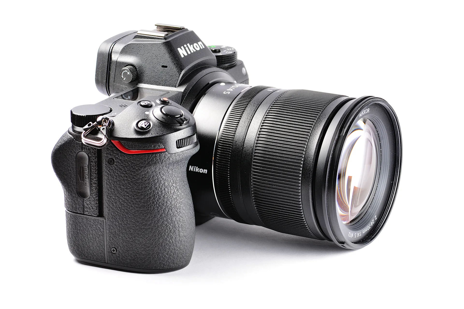 A black Nikon Z6 with a NIKKOR Z 24-70mm f/4 S zoom lens, seen from the front left on a white background